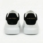 Alexander McQueen Oversized Low-Top Leather Sneaker - White / Black Suede Heel - Image 4